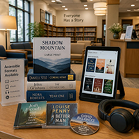A library table displays books, a tablet showing an ebook catalog, audio CDs, and headphones, with a sign listing available accessible formats.