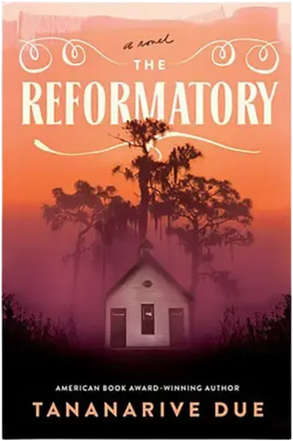 Book cover for “The Reformatory” by Tananarive Due, showing a small house beneath twisted trees in orange-purple mist, creating an eerie mood.